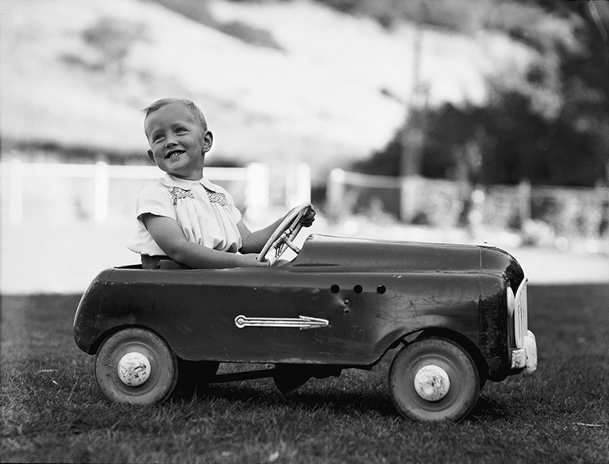 Ian Armstrong in a pedal car